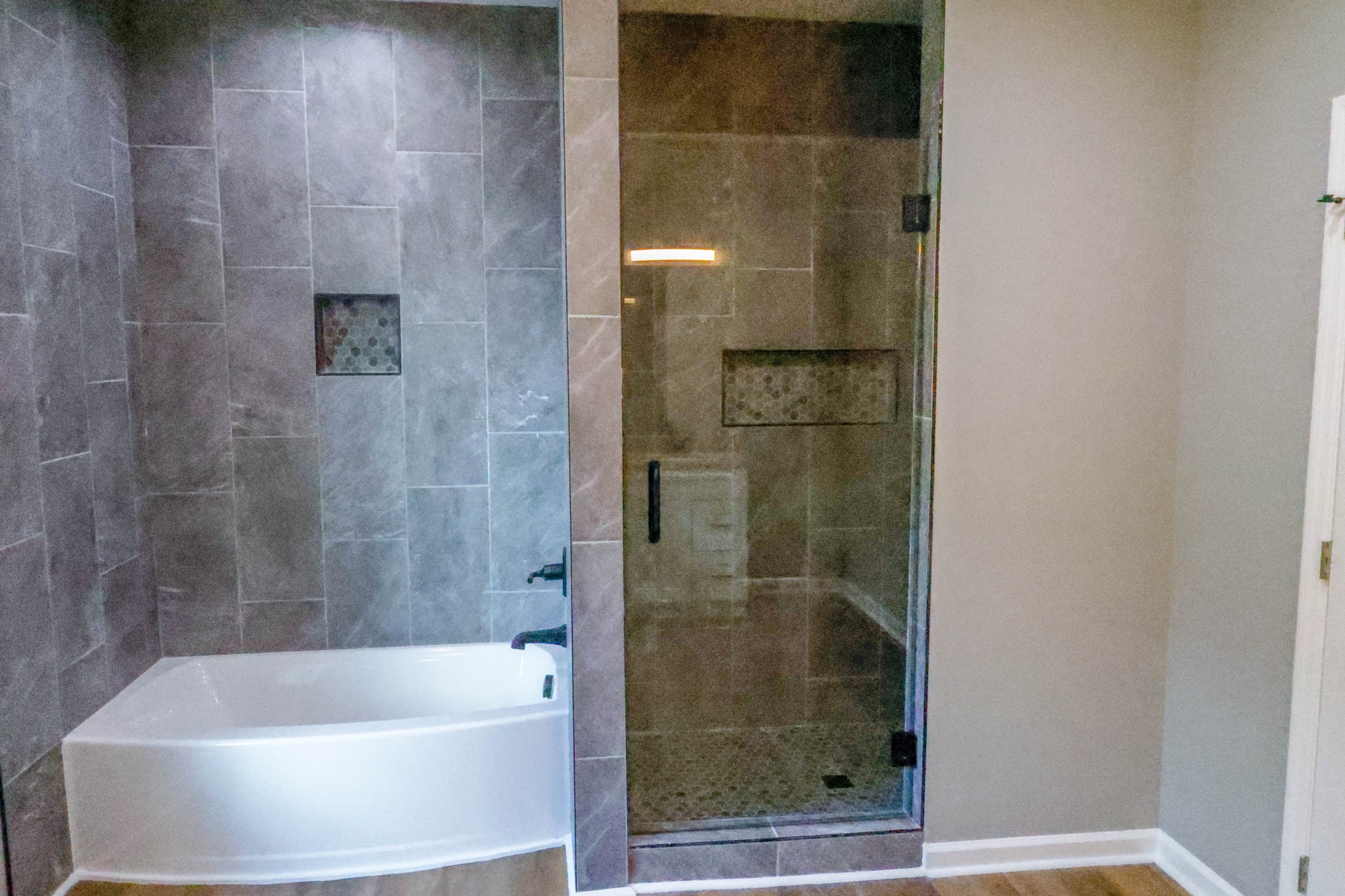 161 Vista Pointe Hohenwald, TN 38462 - Photo 20 of 43 a bathroom with a bathtub and shower