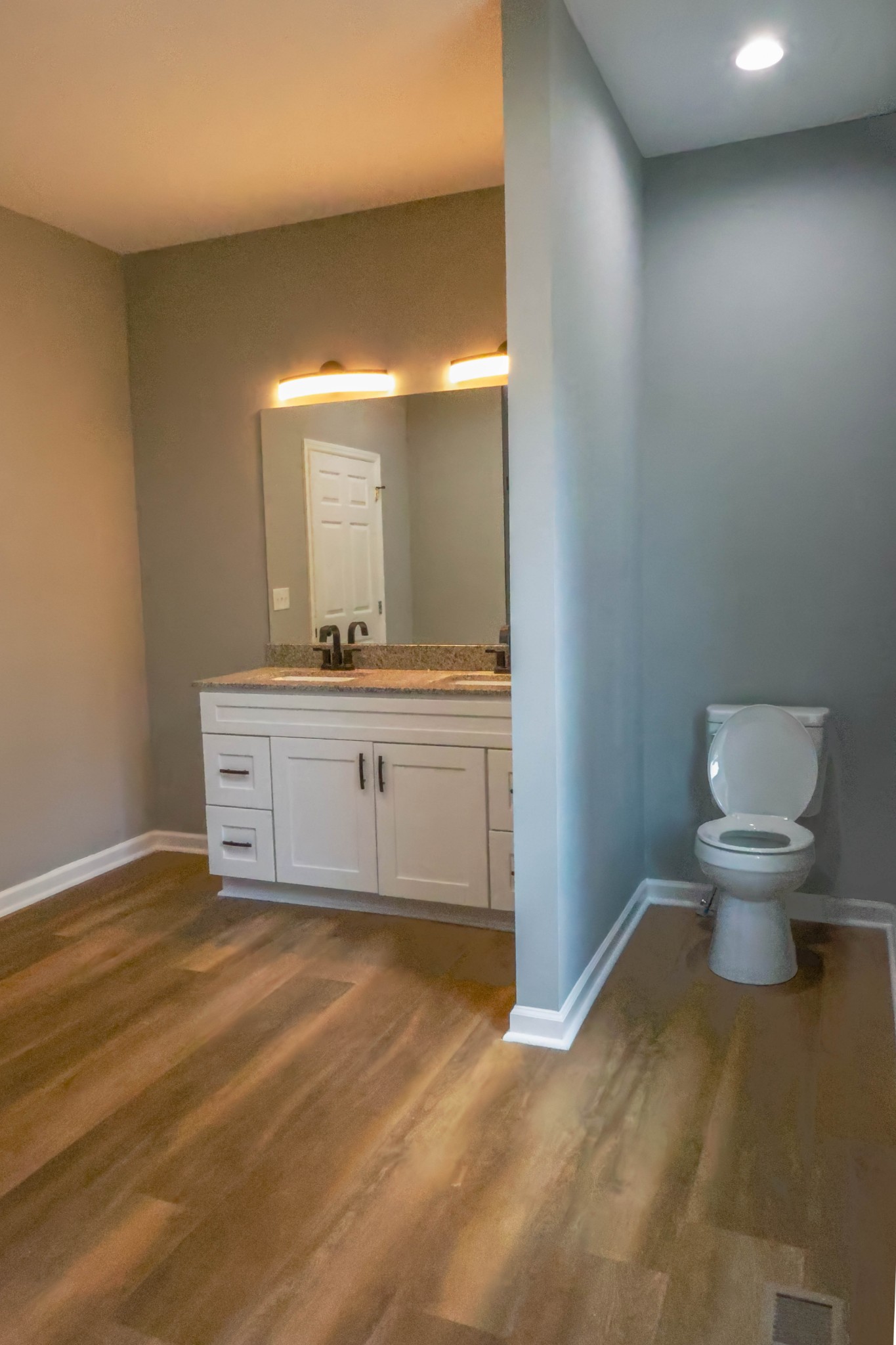 161 Vista Pointe Hohenwald, TN 38462 - Photo 24 of 43 a bathroom with a sink a toilet and a mirror
