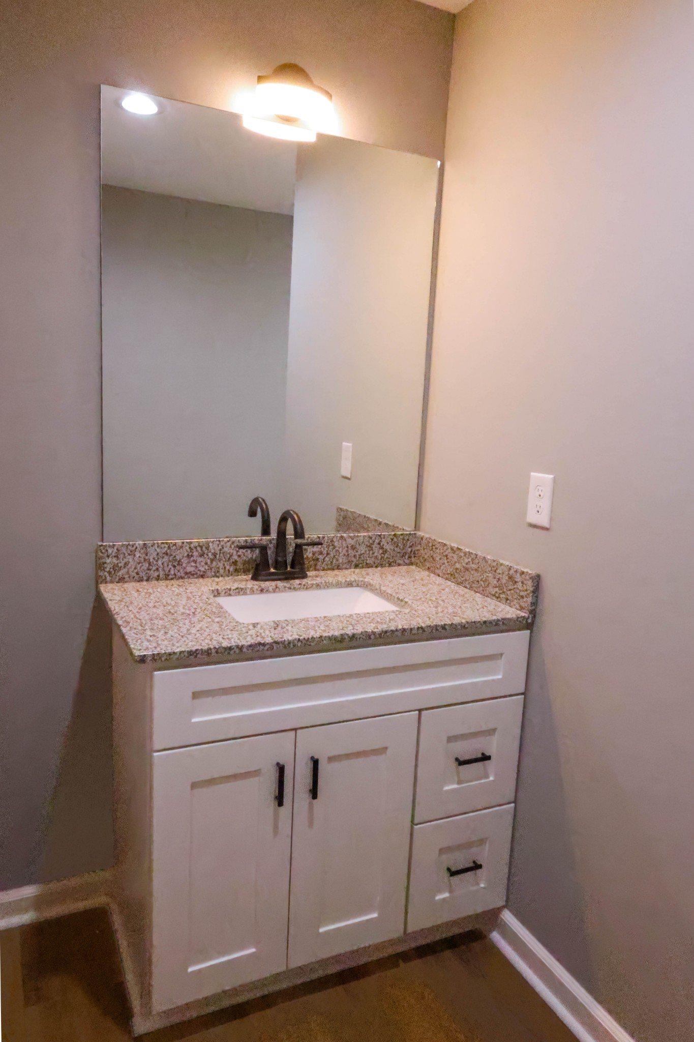 161 Vista Pointe Hohenwald, TN 38462 - Photo 35 of 43 a bathroom with a granite countertop sink and a mirror