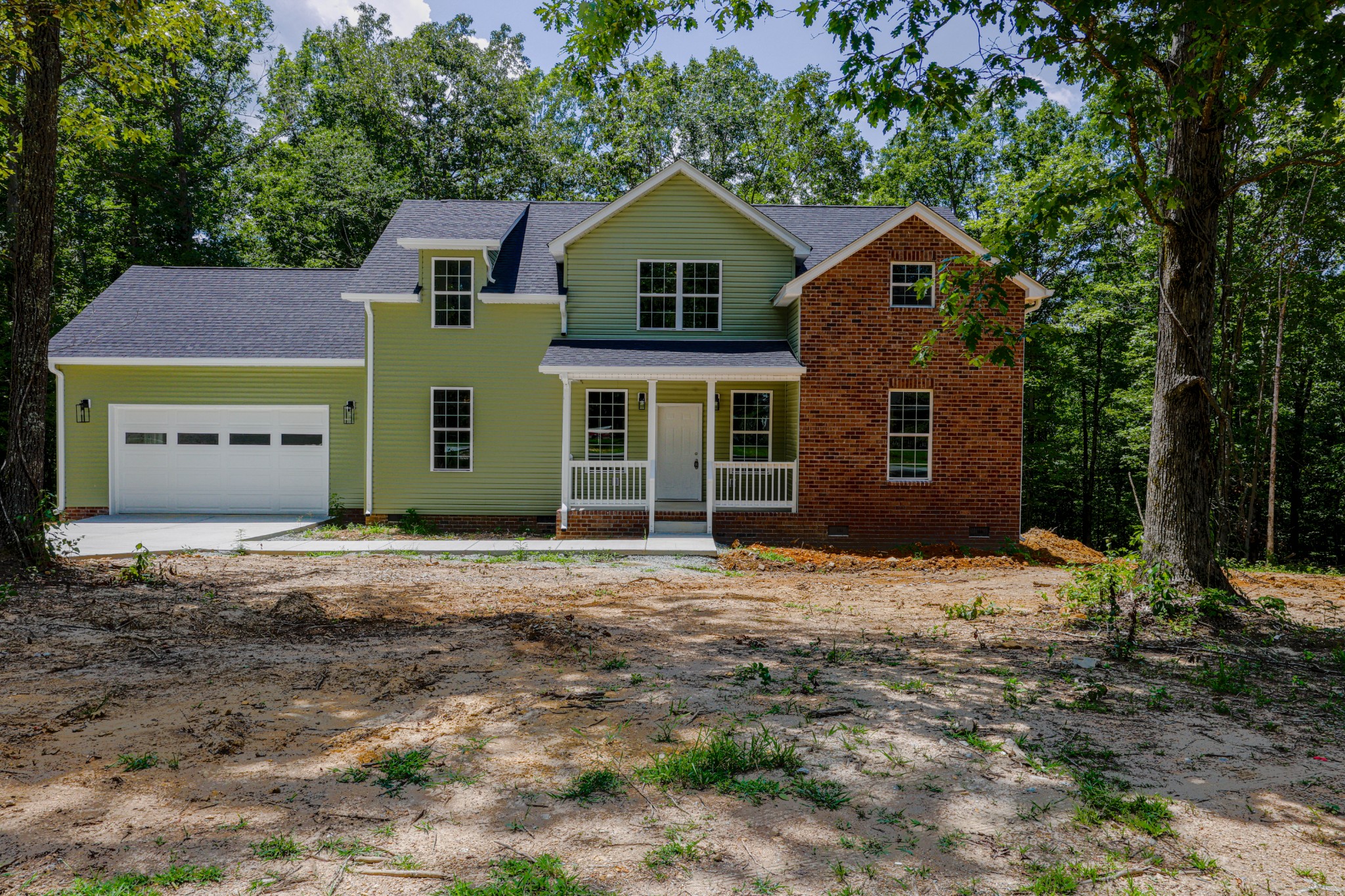 161 Vista Pointe Hohenwald, TN 38462 - Photo 4 of 43 a front view of a house with a yard