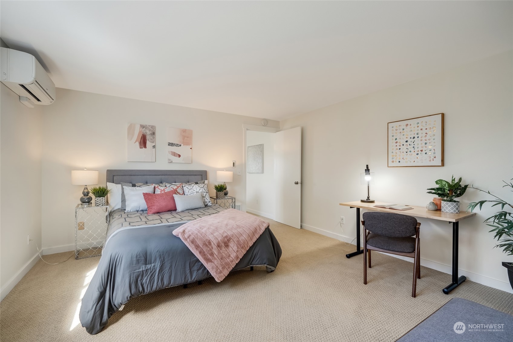 1110 West Howe Street, Unit 304 Seattle, WA 98119 - Photo 12 of 24 a bedroom with a bed and a desk