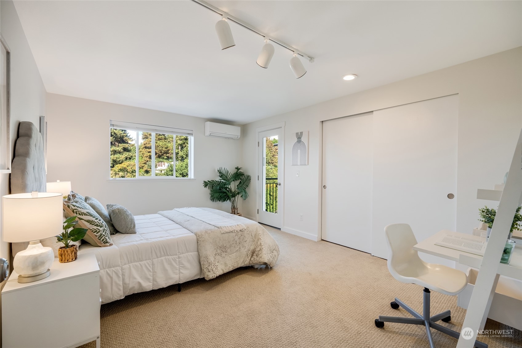 1110 West Howe Street, Unit 304 Seattle, WA 98119 - Photo 15 of 24 a bedroom with a bed and a table in it