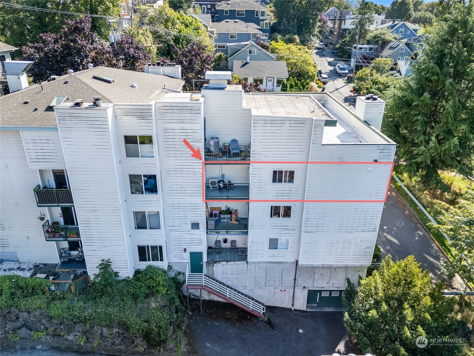 1110 West Howe Street, Unit 304 Seattle, WA 98119 - Photo 19 of 24 an aerial view of residential houses with outdoor space and street view