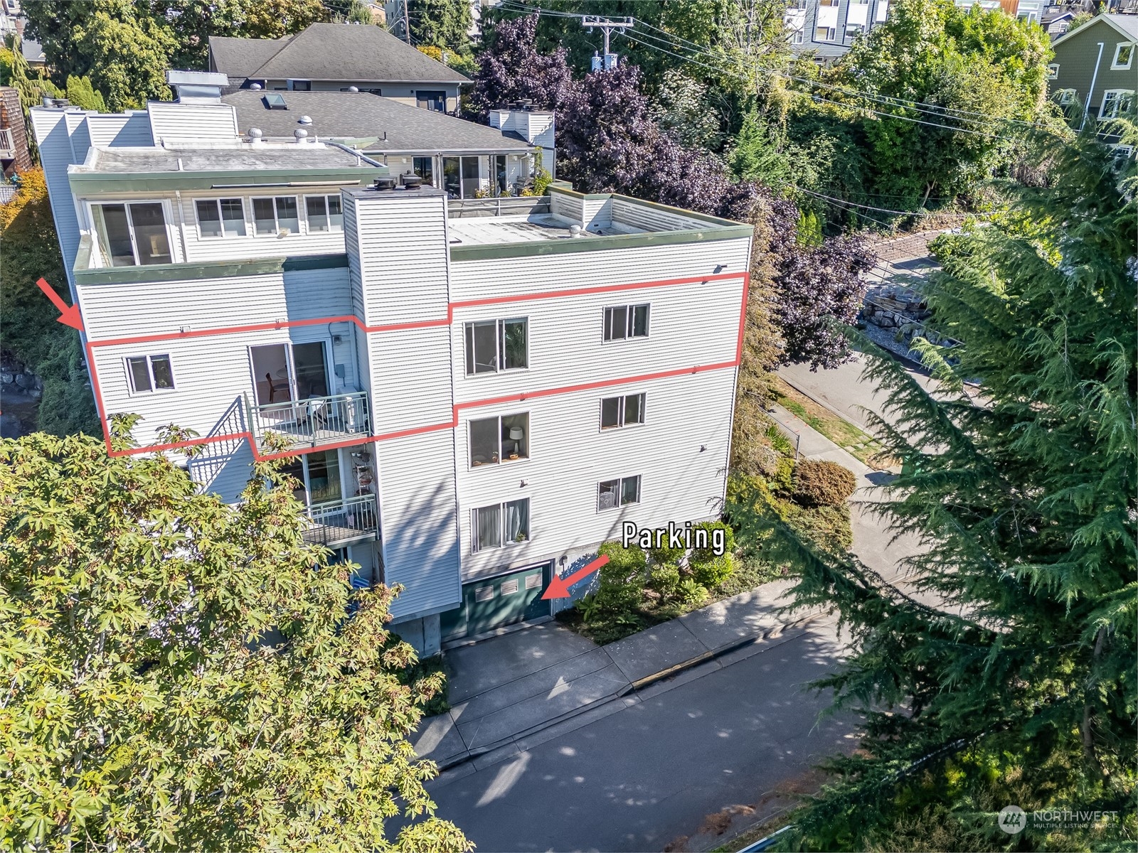 1110 West Howe Street, Unit 304 Seattle, WA 98119 - Photo 24 of 24 front view of a house with a yard