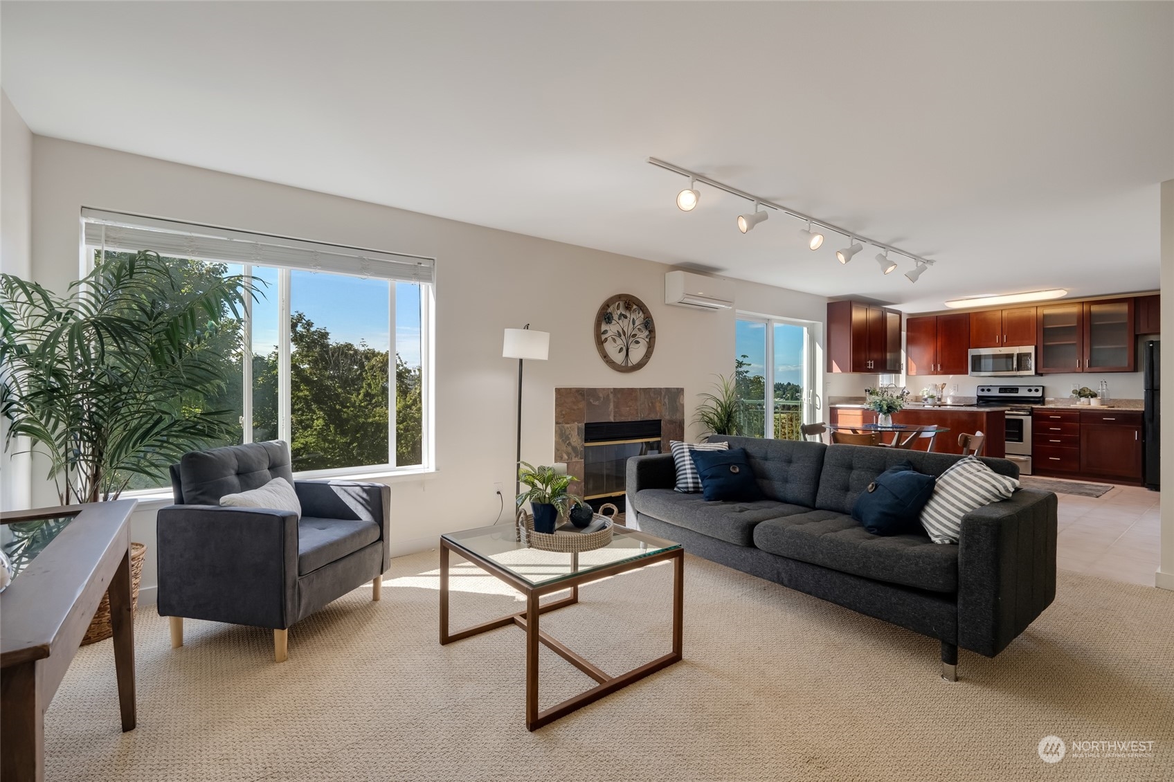 1110 West Howe Street, Unit 304 Seattle, WA 98119 - Photo 4 of 24 a living room with furniture and a fireplace
