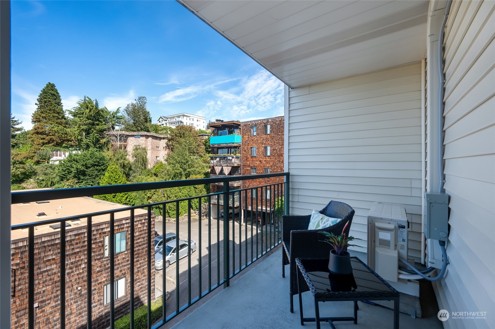1110 West Howe Street, Unit 304 Seattle, WA 98119 - Photo 9 of 24 a view of a chairs and table in the balcony