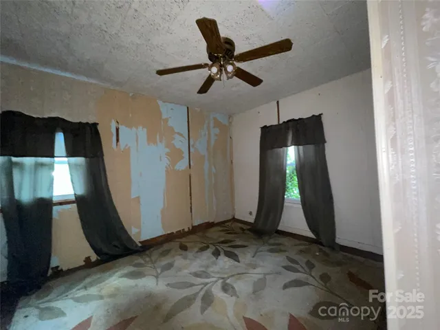 a kitchen with stainless steel appliances wooden cabinets and a refrigerator