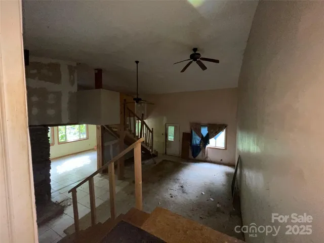 a view of a hallway with wooden cabinets