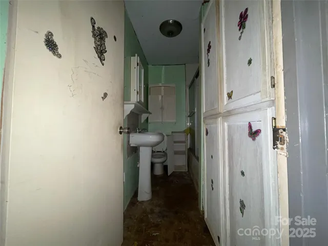 a bathroom with a sink and shower