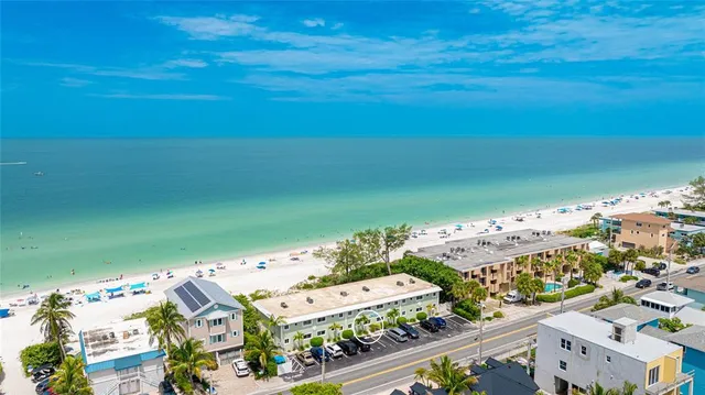 a living room with furniture a flat screen tv and a large window