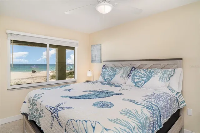 a bedroom with a large bed and a window