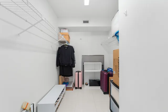 a view of storage and utility room with washer and dryer