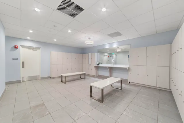 a view of a livingroom with furniture and white walls