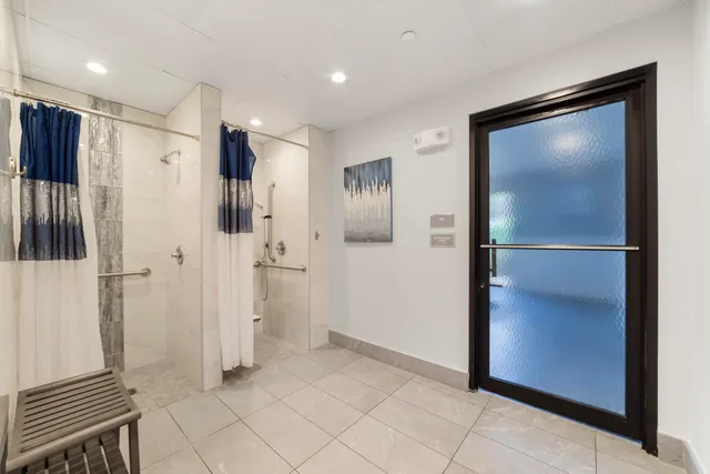 a view of a refrigerator in kitchen and wooden floor