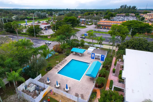 an aerial view of a house with a garden