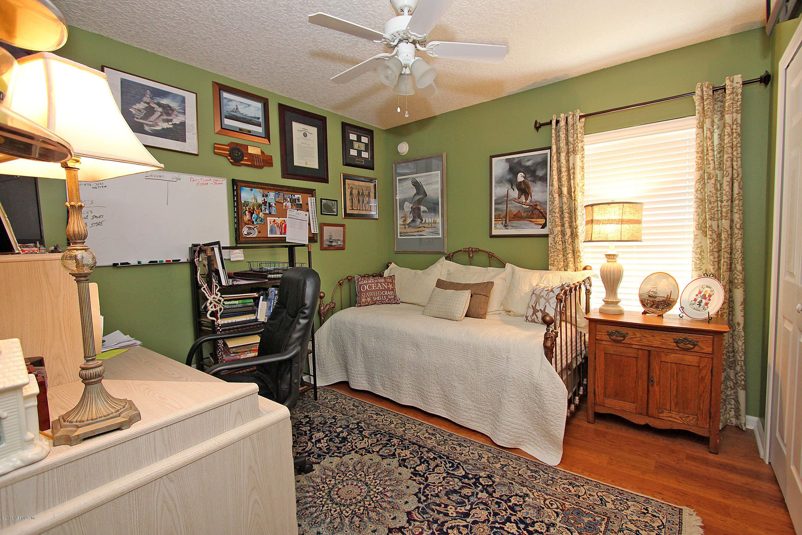 1232 Ribbon Road St. Johns, FL 32259 - Photo 17 of 27 a bed room with a bed and a desk