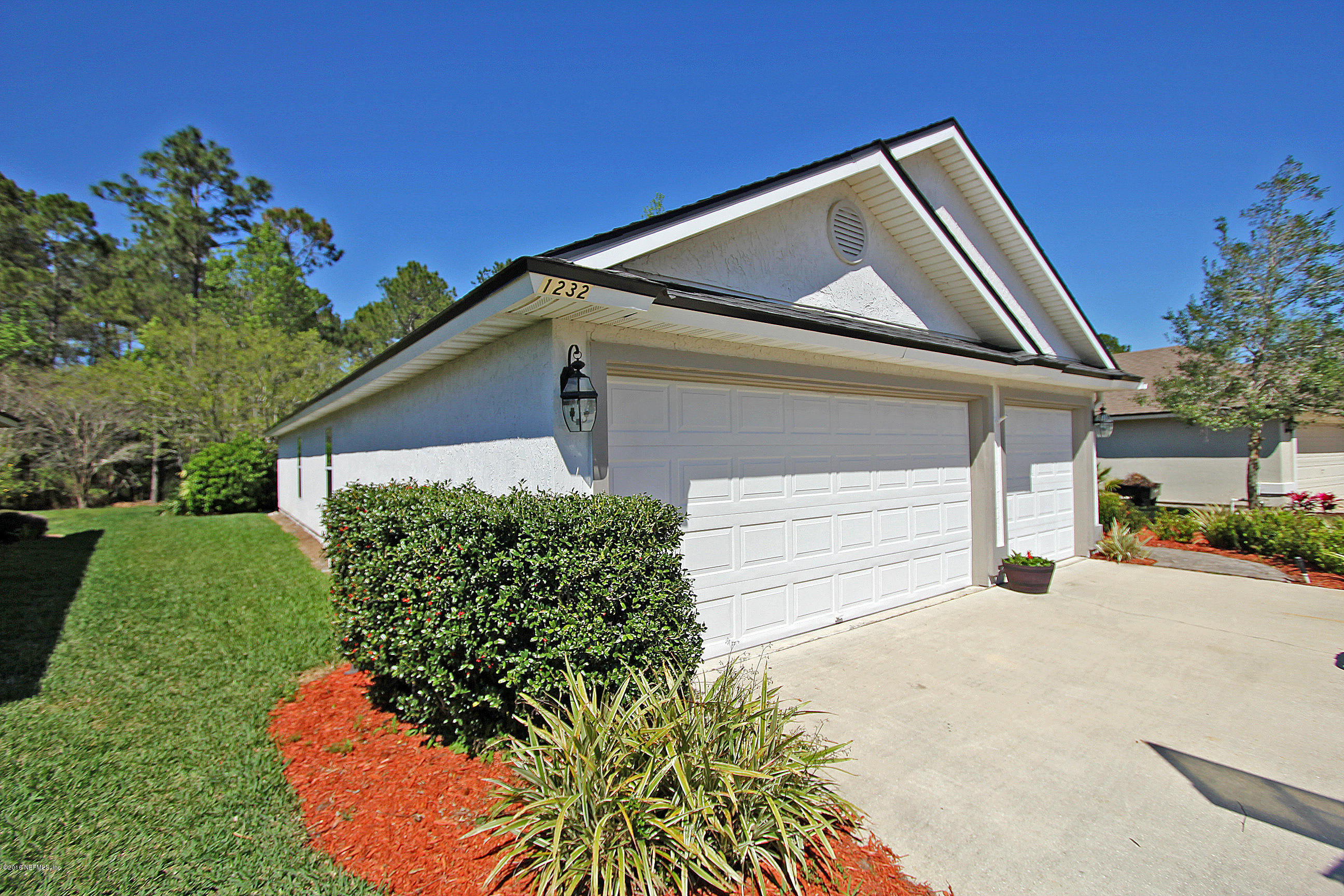 1232 Ribbon Road St. Johns, FL 32259 - Photo 2 of 27 a front view of a house with garden