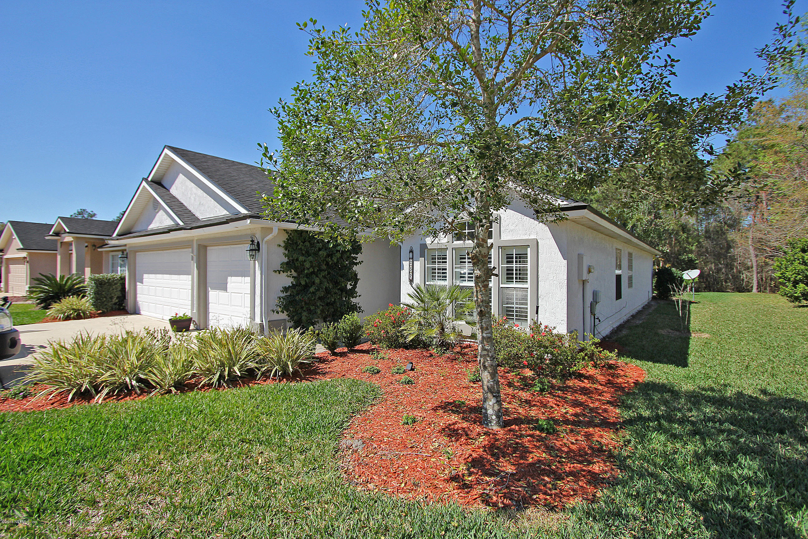 1232 Ribbon Road St. Johns, FL 32259 - Photo 3 of 27 a front view of a house with garden