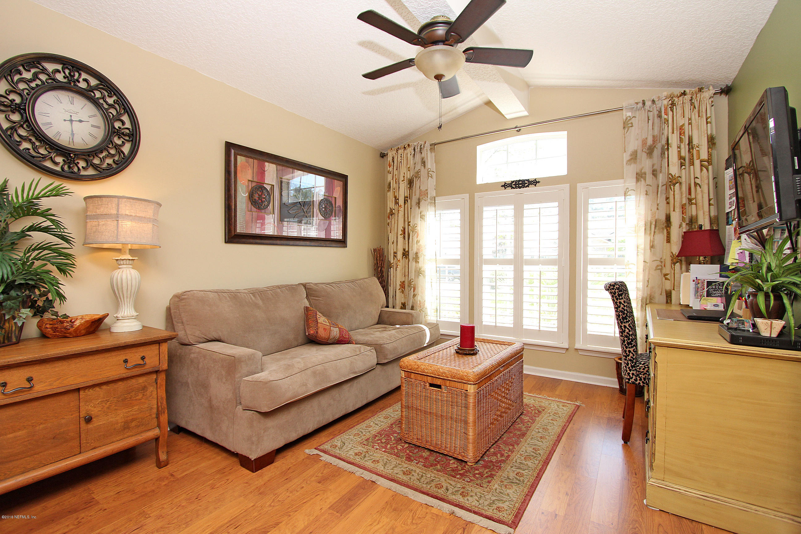 1232 Ribbon Road St. Johns, FL 32259 - Photo 4 of 27 a living room with furniture a flat screen tv and a window