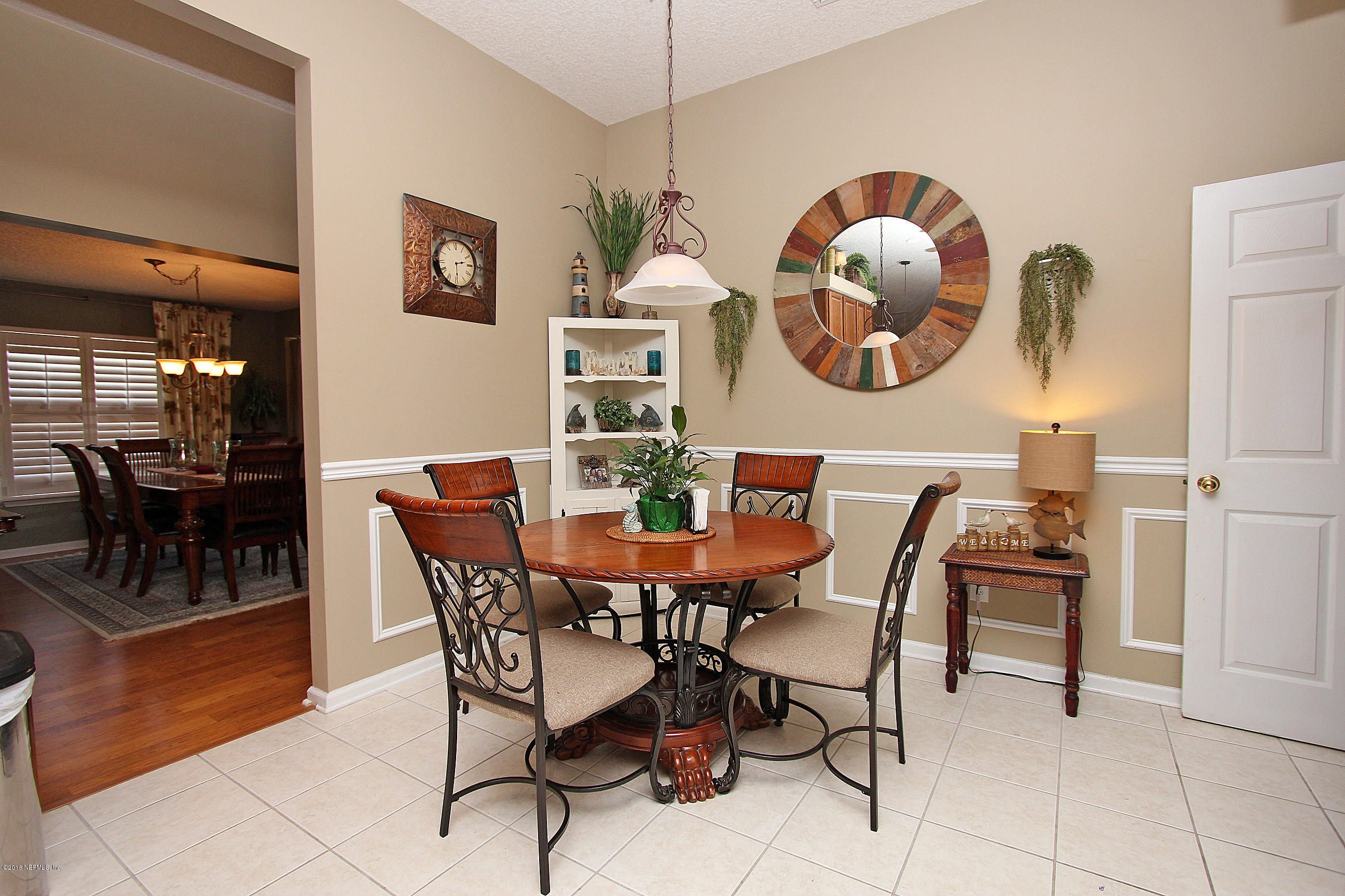 1232 Ribbon Road St. Johns, FL 32259 - Photo 9 of 27 a dining room with furniture and a large window