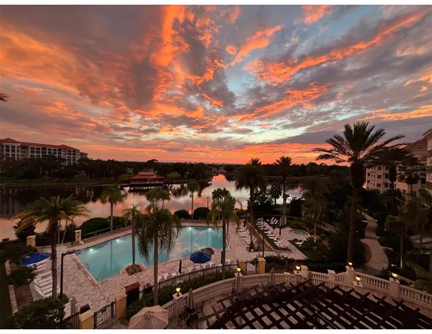 an aerial view of a city and lake view