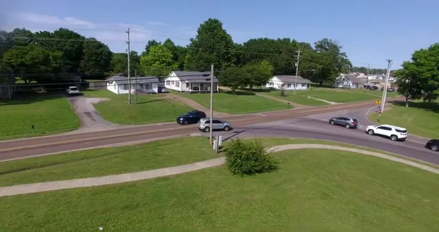 a view of a swimming pool with a yard
