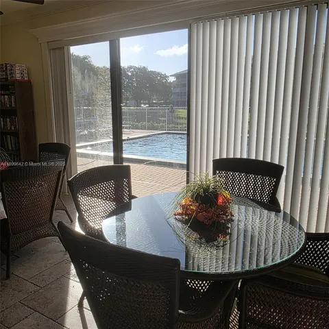 a bedroom with furniture and a flat screen tv