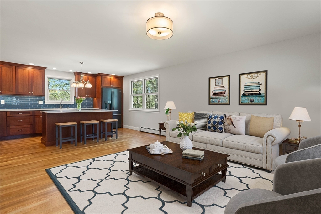 336 Sharpners Pond Road North Andover, MA 01845 - Photo 13 of 42 a living room with furniture a rug and a table