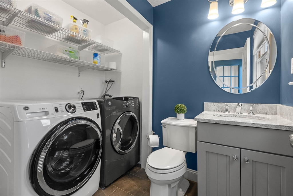 336 Sharpners Pond Road North Andover, MA 01845 - Photo 16 of 42 a bathroom with a sink mirror and toilet