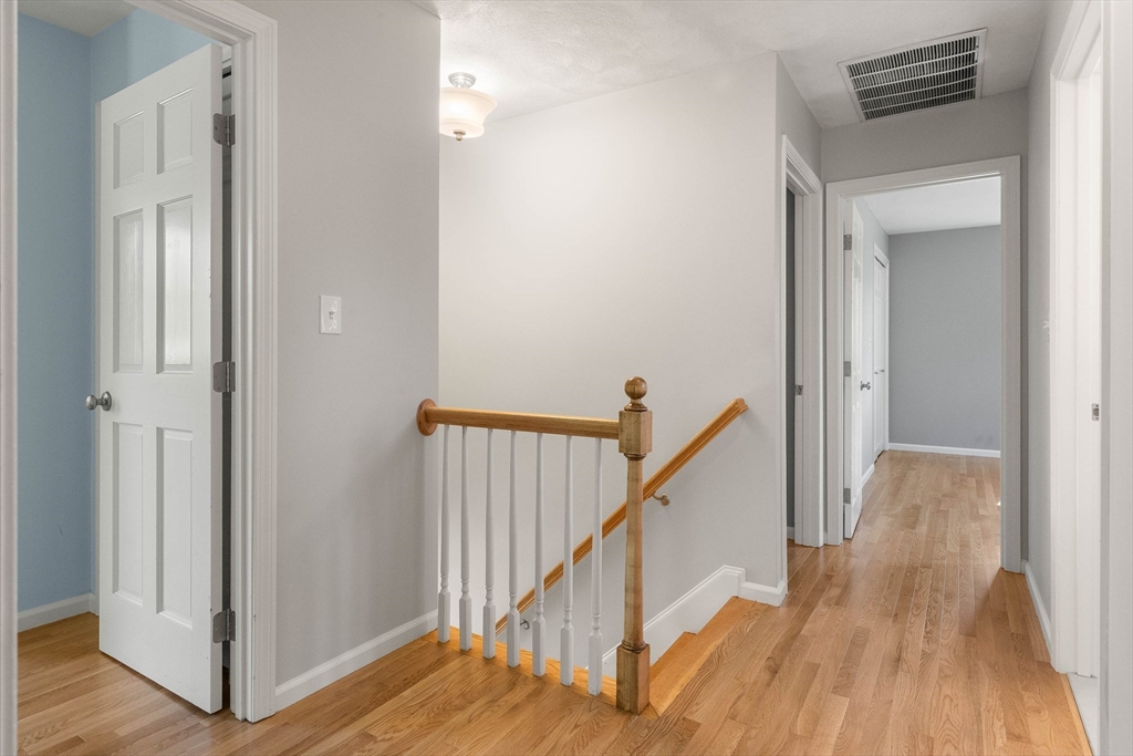 336 Sharpners Pond Road North Andover, MA 01845 - Photo 17 of 42 a view of a hallway with wooden floor and entryway