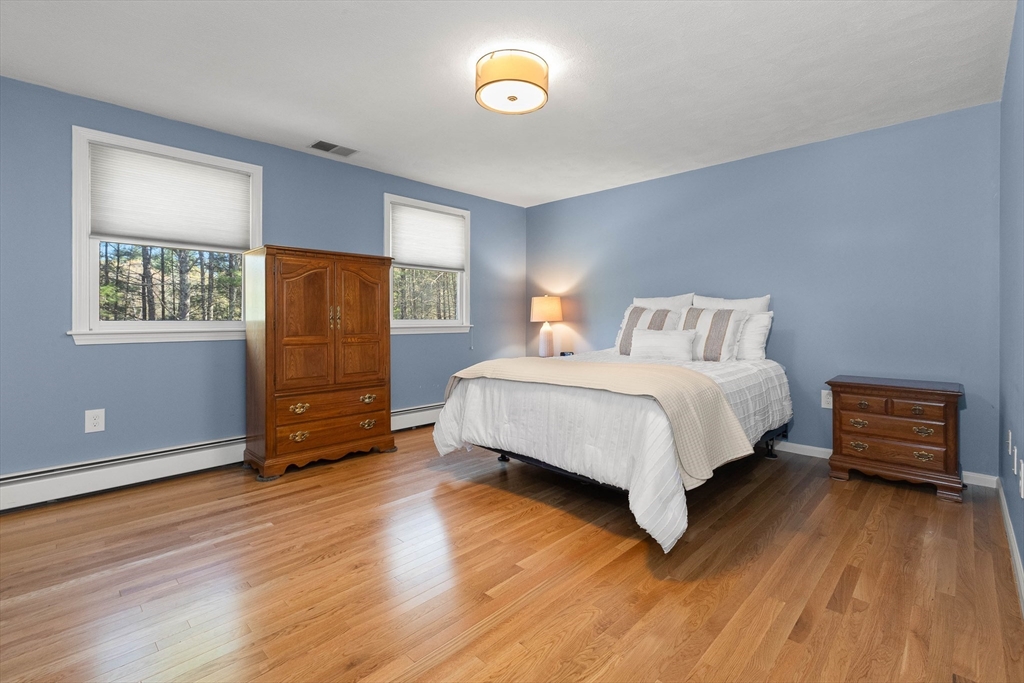 336 Sharpners Pond Road North Andover, MA 01845 - Photo 18 of 42 a bed room with a bed and a closet