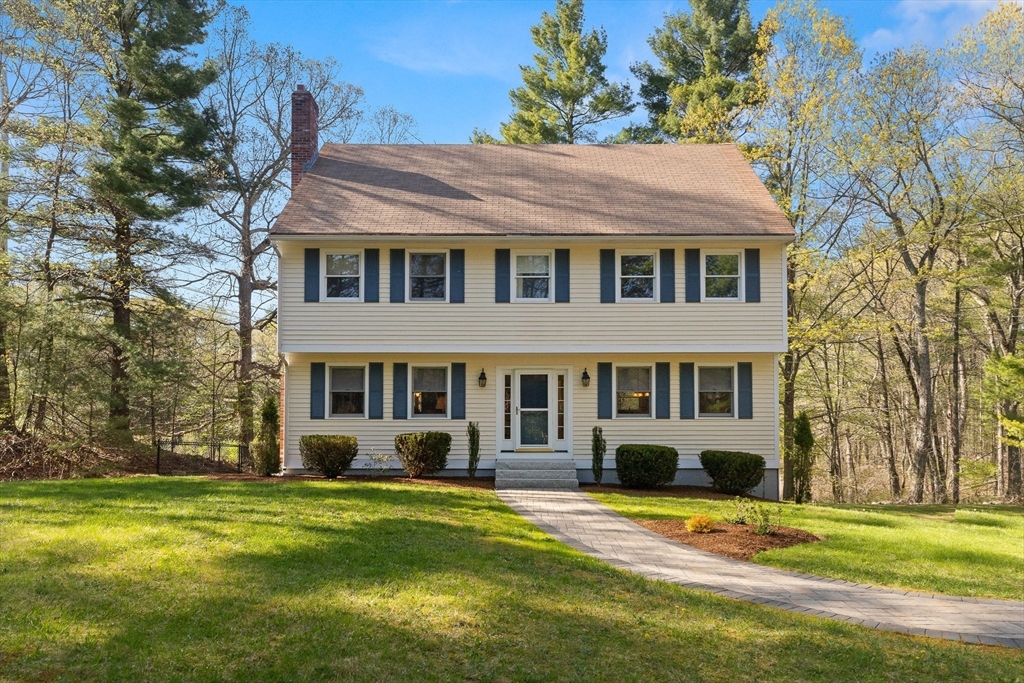 336 Sharpners Pond Road North Andover, MA 01845 - Photo 2 of 42 a front view of a house with a yard table and chairs