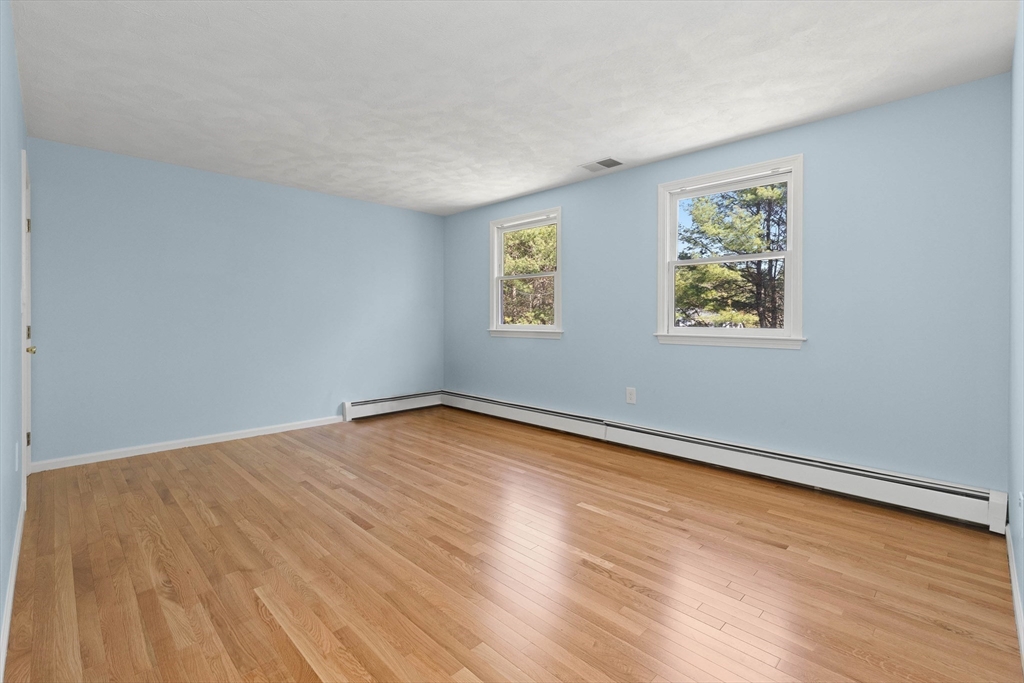 336 Sharpners Pond Road North Andover, MA 01845 - Photo 25 of 42 a view of empty room with wooden floor and fan
