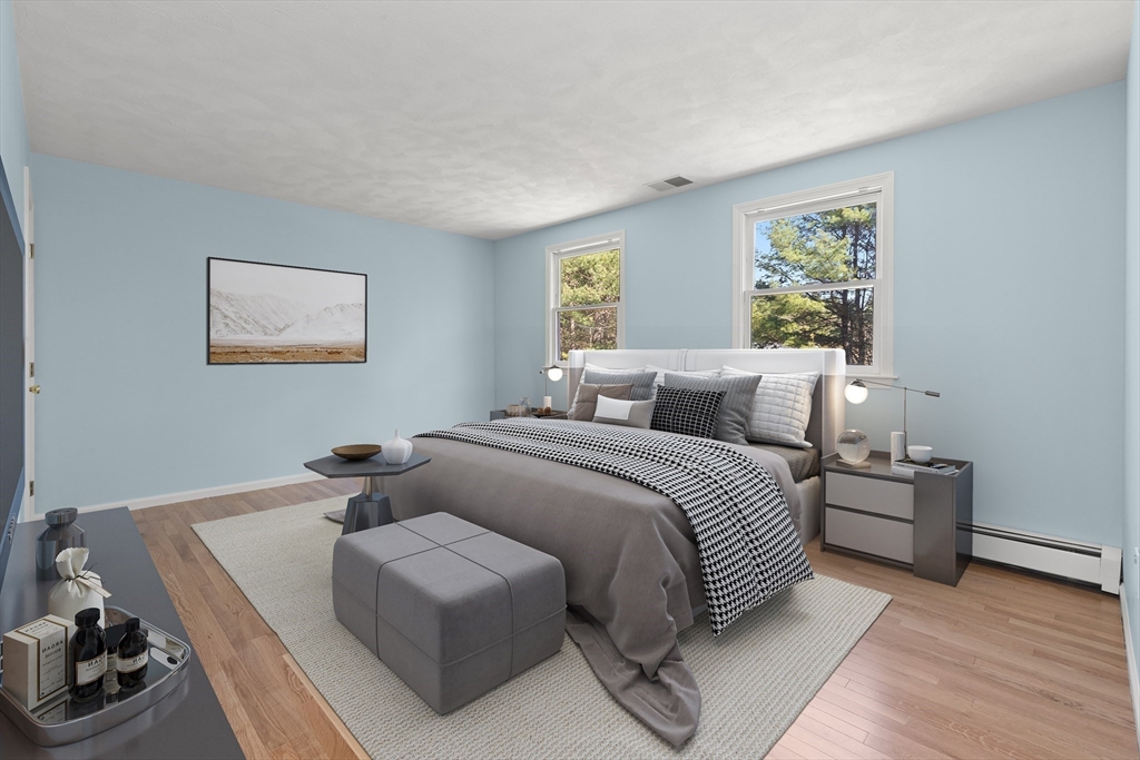 336 Sharpners Pond Road North Andover, MA 01845 - Photo 26 of 42 a bedroom with a bed and wooden floor