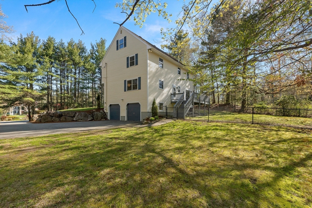 336 Sharpners Pond Road North Andover, MA 01845 - Photo 36 of 42 a view of a house with a yard