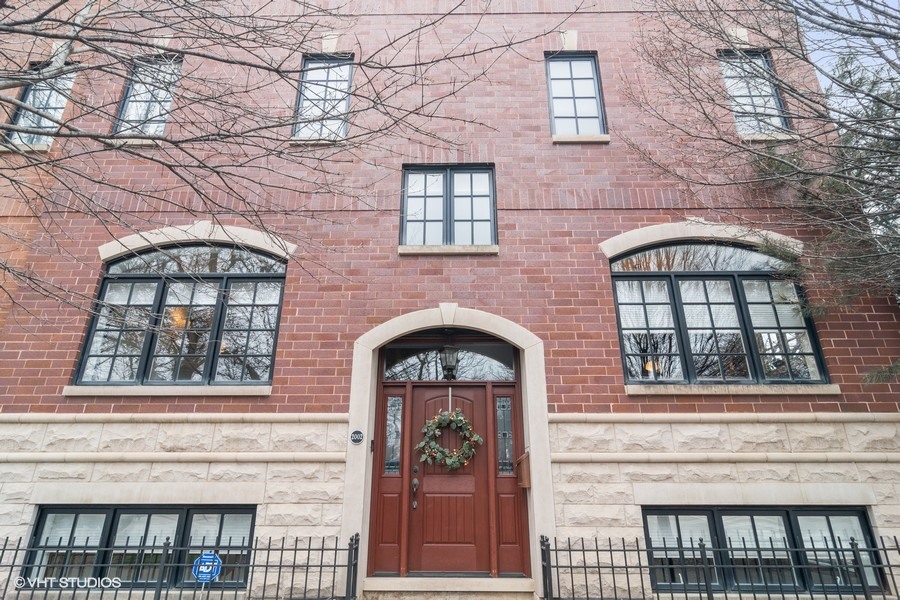 2002 West Barry Avenue Chicago, IL 60618 - Photo 1 of 25 a front view of a brick house with large windows