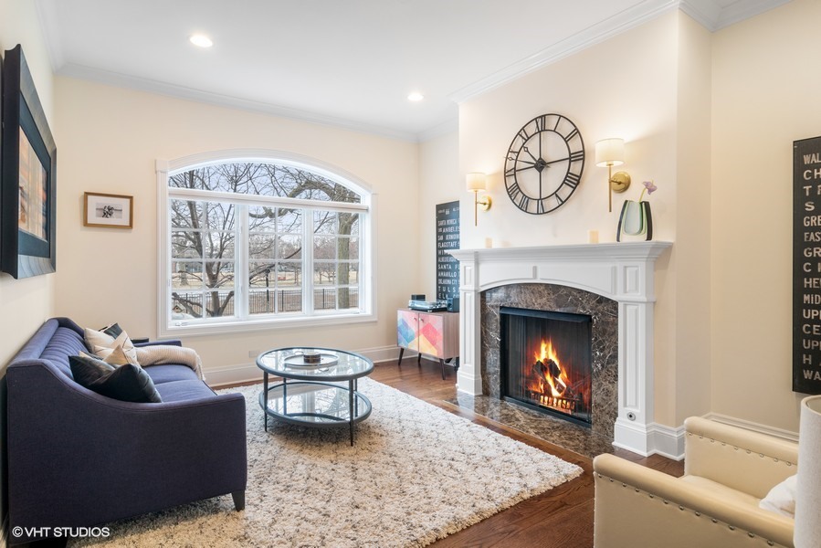 2002 West Barry Avenue Chicago, IL 60618 - Photo 2 of 25 a living room with furniture a window and a fireplace