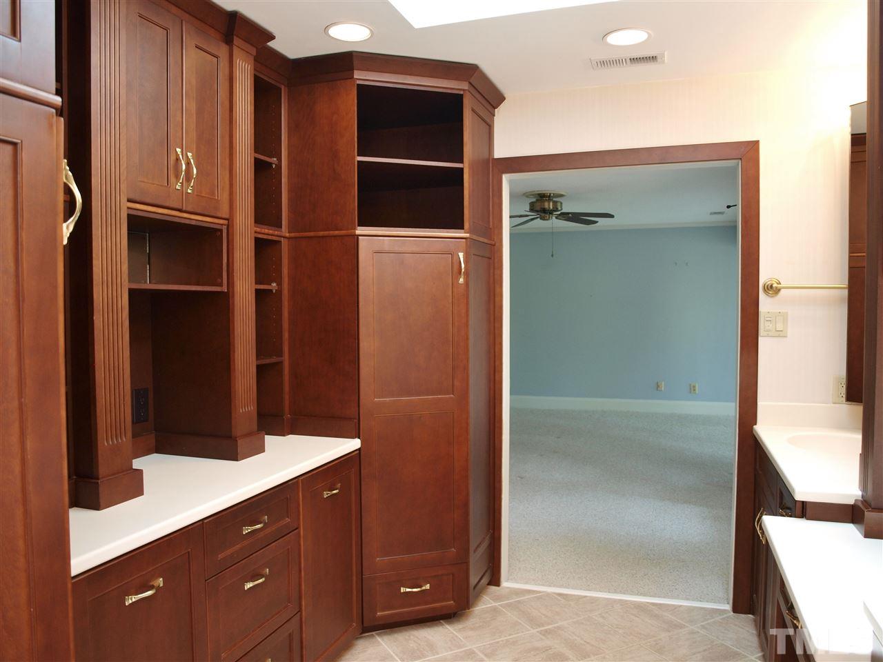 6705 Foxfire Place Raleigh, NC 27615 - Photo 14 of 30 a bathroom with a shower and a sink