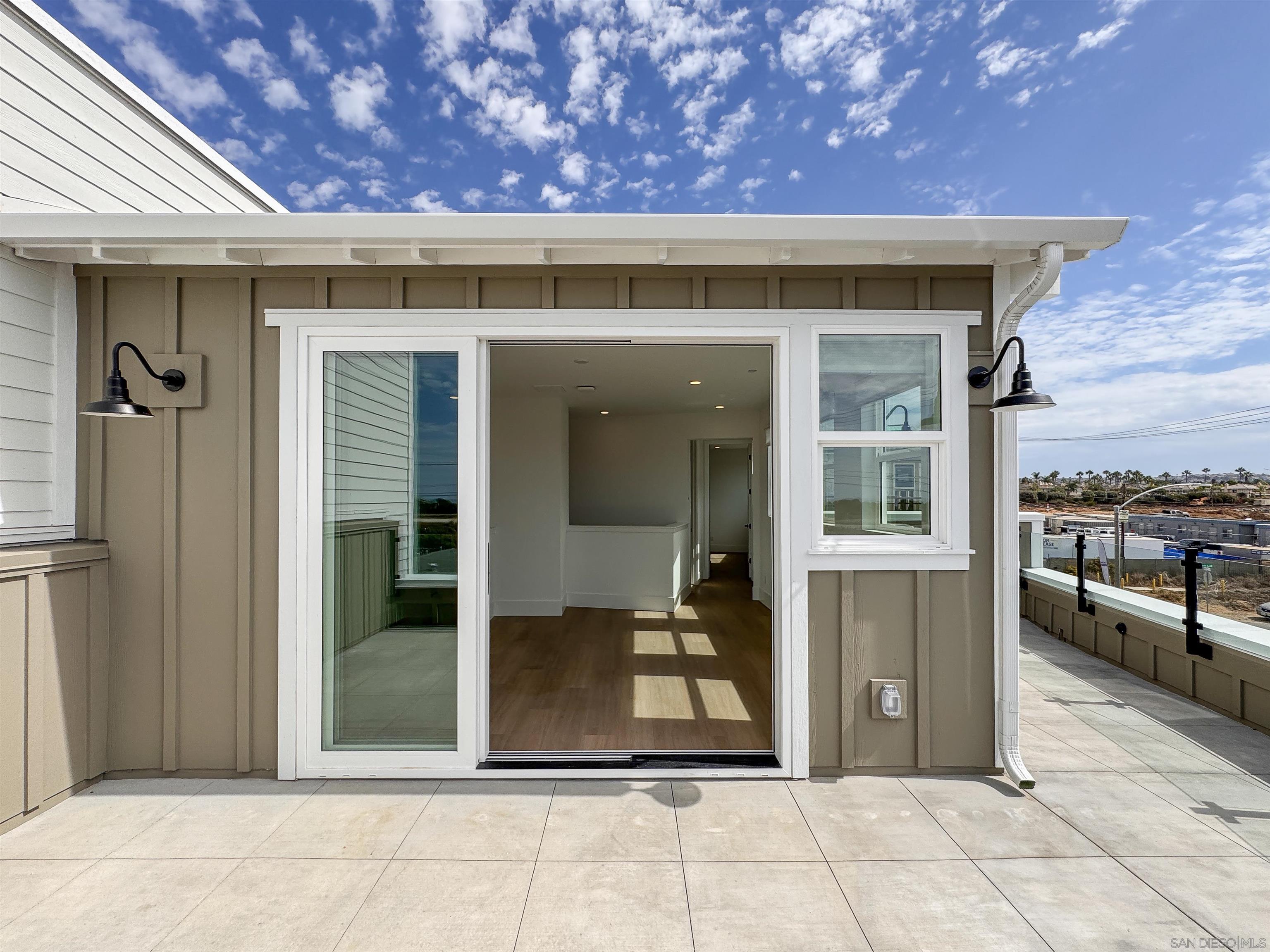 7290 Ponto Drive, Unit 7302 Carlsbad, CA 92011 - Photo 29 of 54 a view of a brick house with a large window