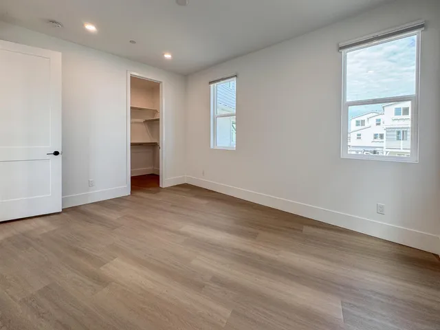 a bathroom with double sink and a mirror