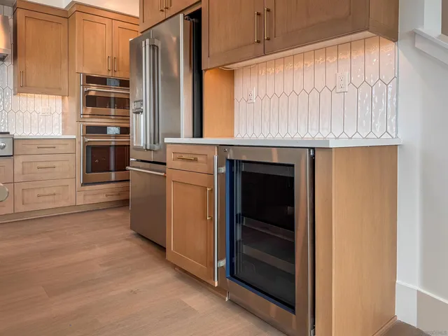 a kitchen with granite countertop a stove and a microwave