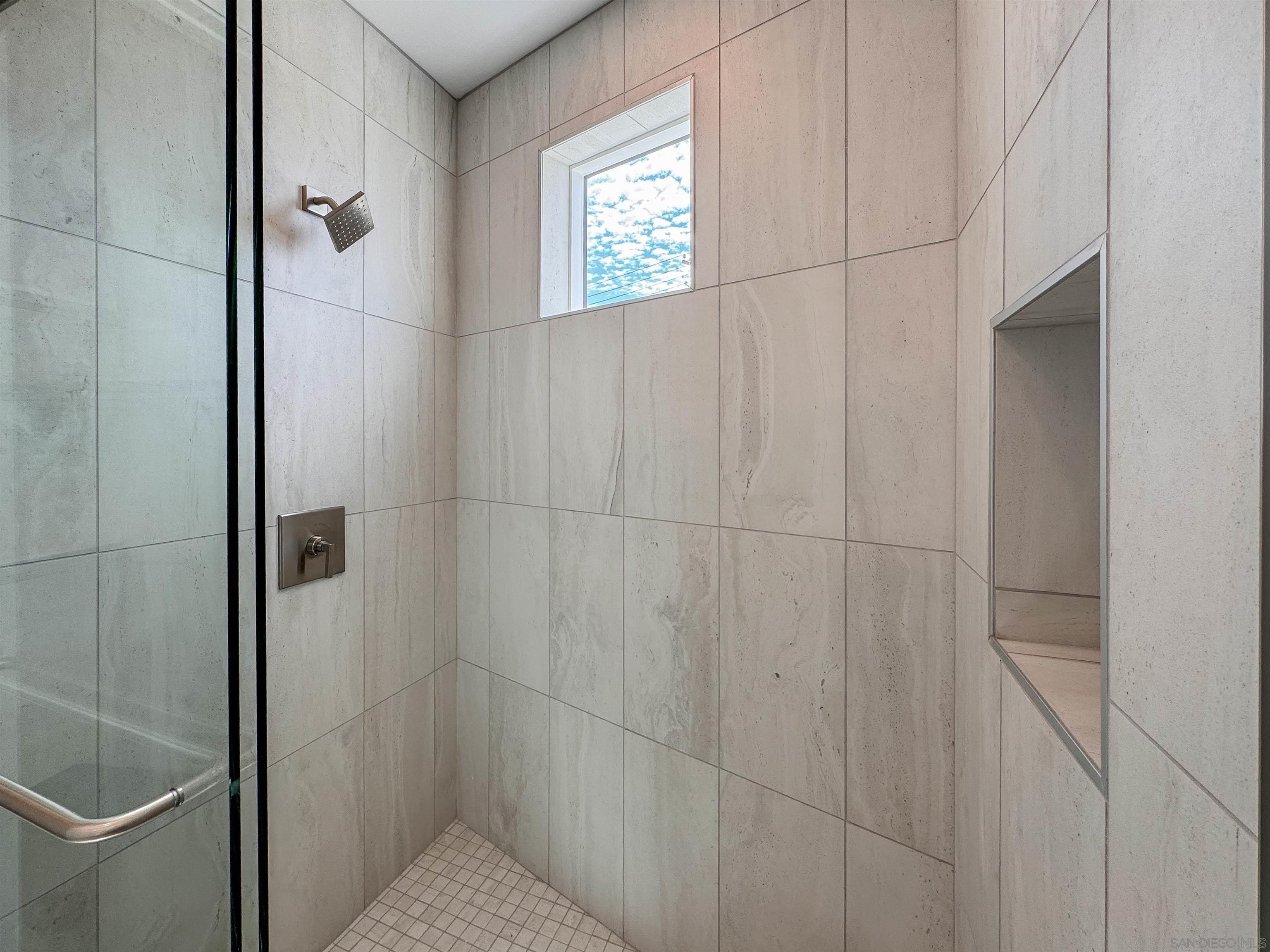7290 Ponto Drive, Unit 7302 Carlsbad, CA 92011 - Photo 47 of 54 a bathroom with a shower