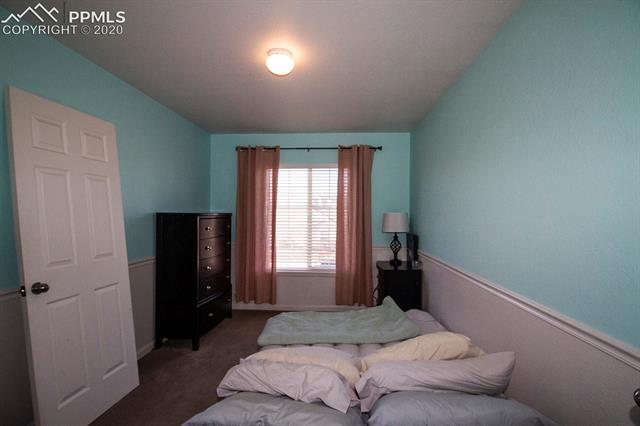 6789 Akron Road Colorado Springs, CO 80923 - Photo 19 of 28 Bedroom upstairs