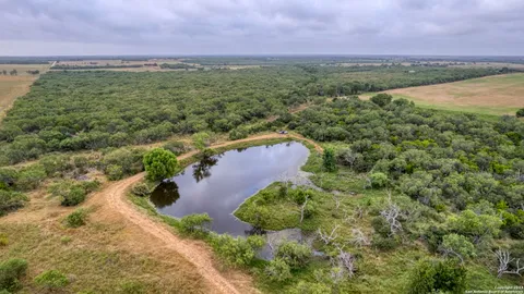 a view of a lake with green space
