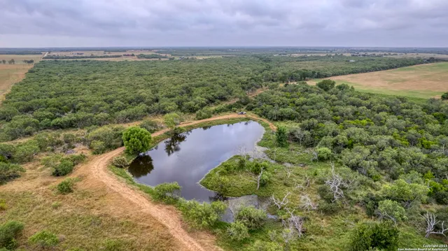 a view of a lake with green space