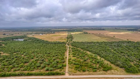 a view of a lake with houses in the back