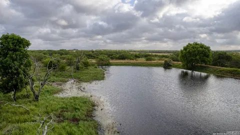 a view of a lake and a yard