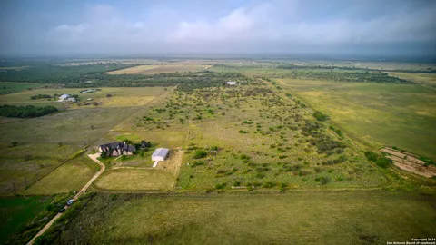 a view of an entryway with wooden floor and stairs