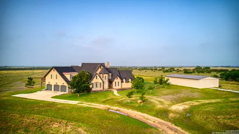 a living room with furniture ceiling fan and a rug