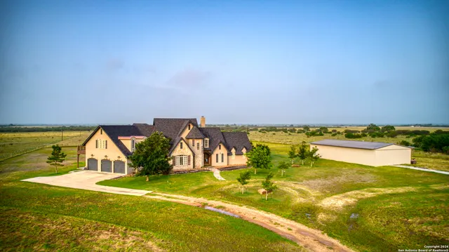 a living room with furniture ceiling fan and a rug